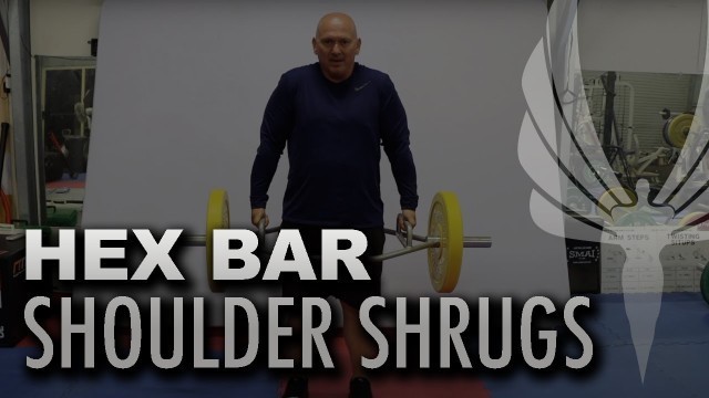 'Performing Hex Bar Shoulder Shrugs with Global Fitness Institute'