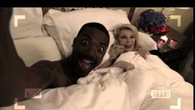 'Ray J and Joan River of fashion Police on bed'